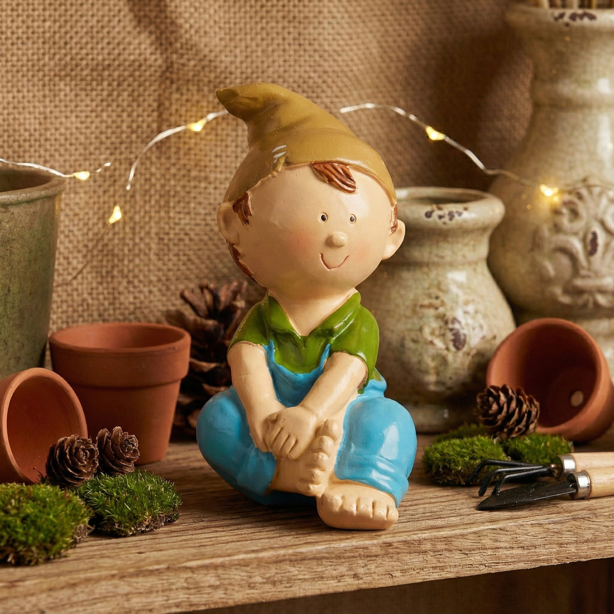 The Writershub Cute Sitting Boy Decorative Showpiece – Multicolour